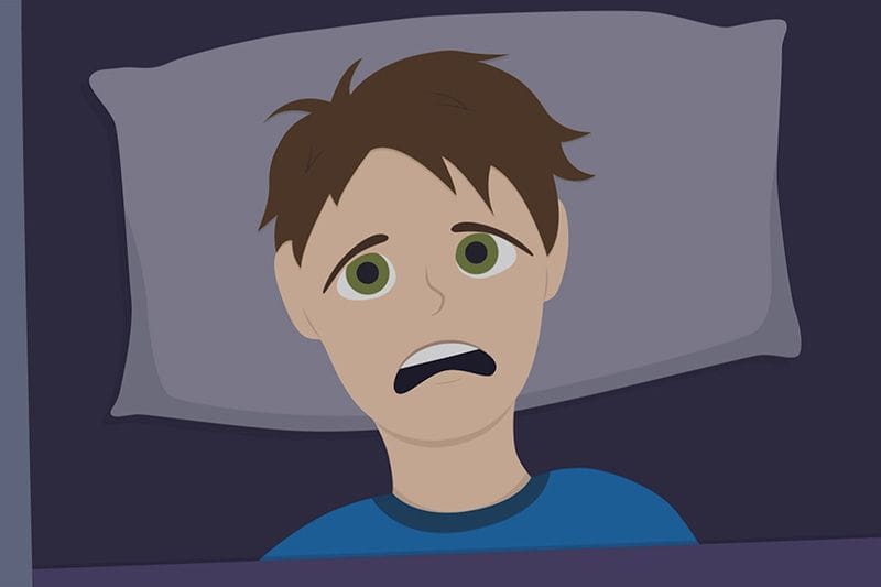 Image of someone laying in their bed looking distressed. Video - Why Is My HVAC Unit Making Unusual Noises?