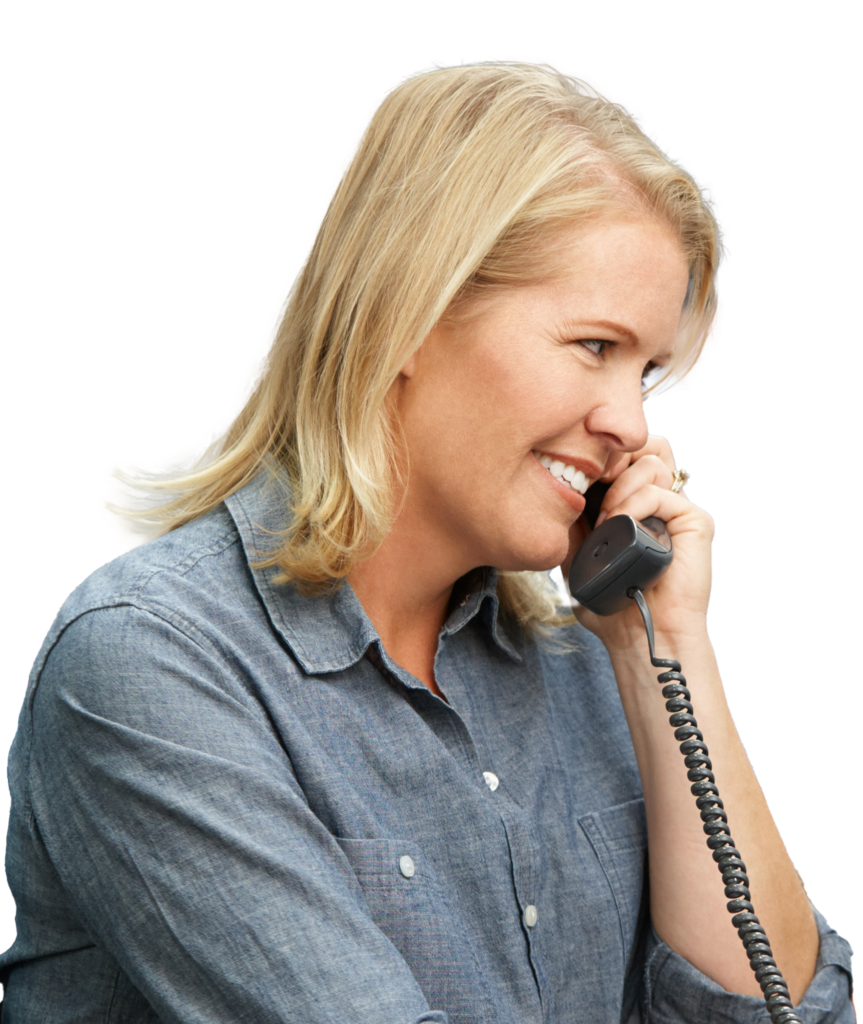 Businesswoman Working At Desk In Warehouse.